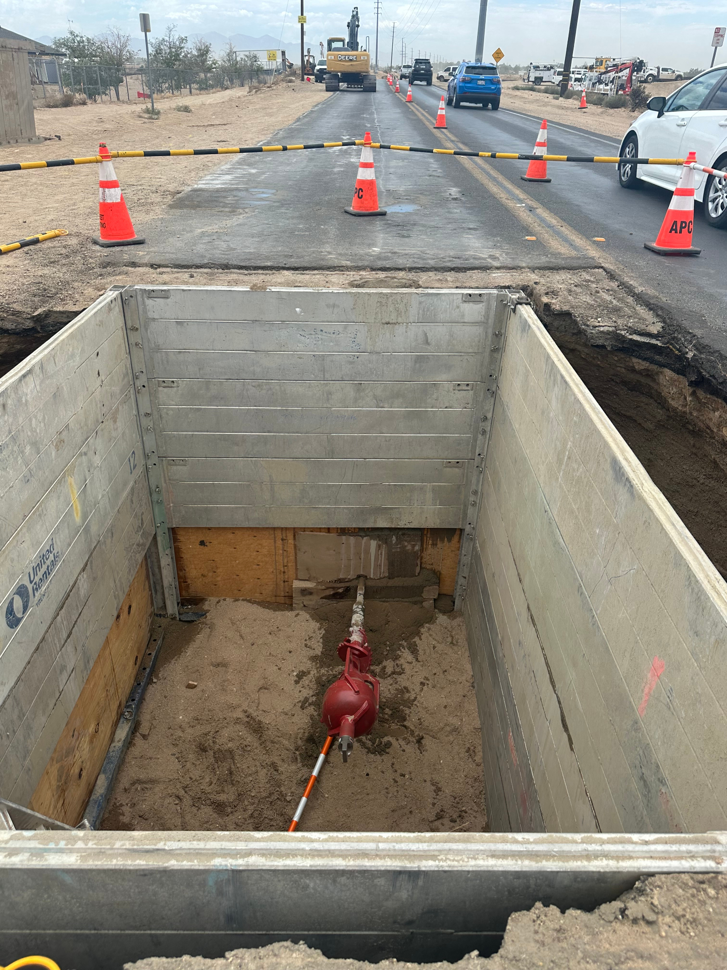 Shored bore pit with pilot bit exiting under a live roadway